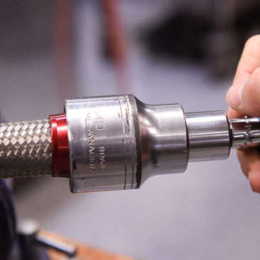 Use a palm wrench to install braided stainless hose to the threads of AN fittings